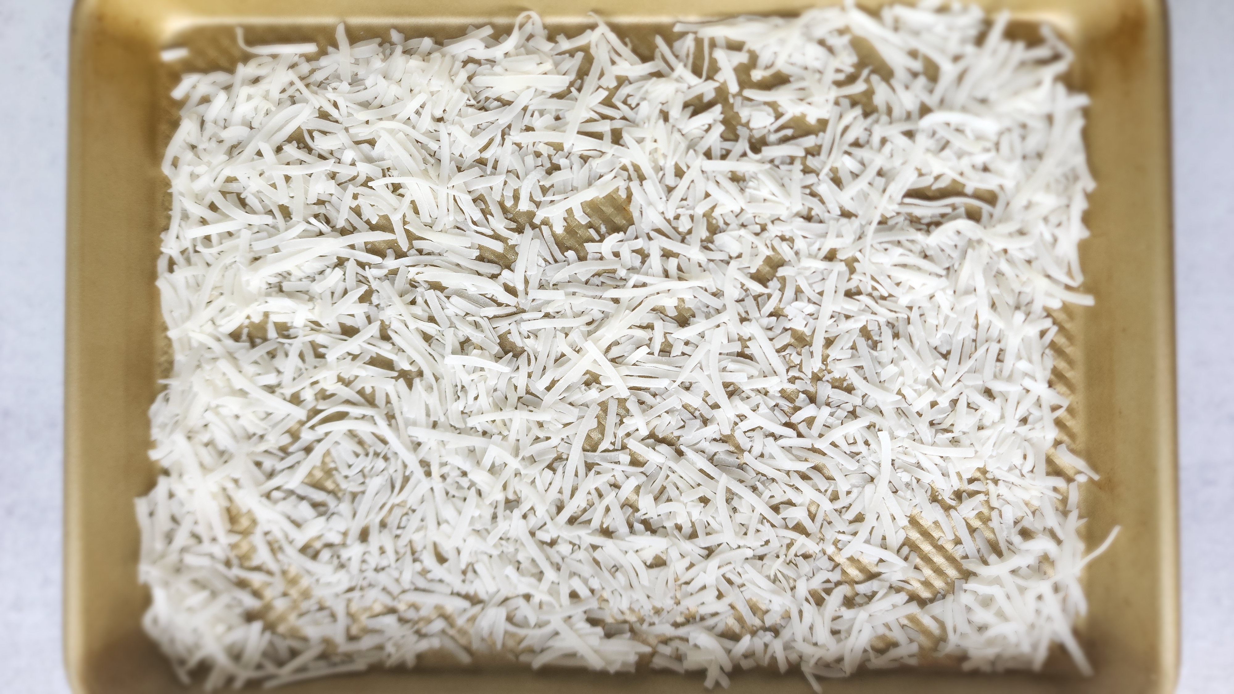 Coconut flakes on a sheet pan