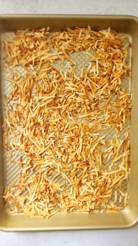 sheet pan of toasted coconut flakes