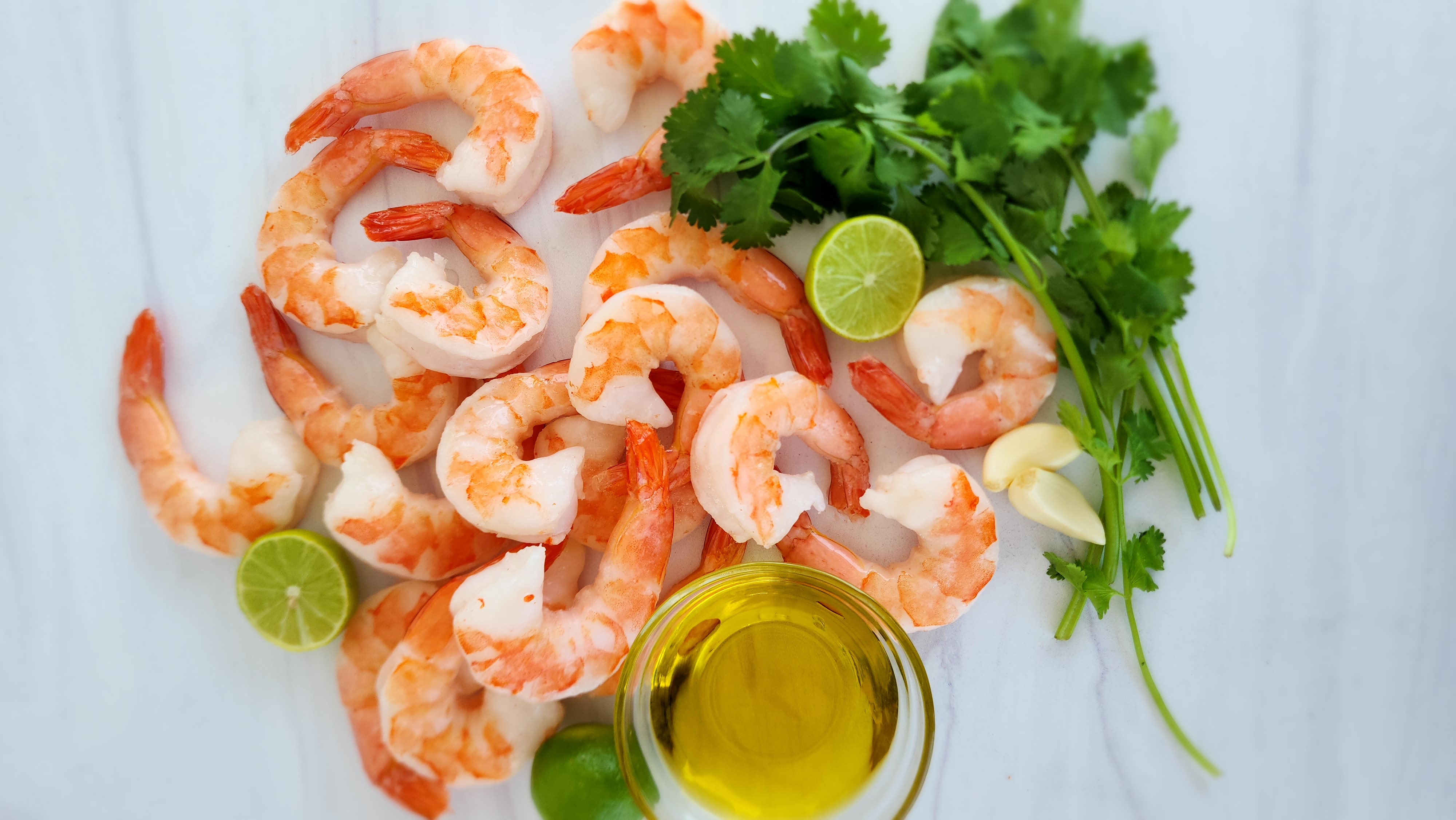 ingredients for key lime shrimp: shrimp, cilantro, olive oil, key lime juice, and garlic