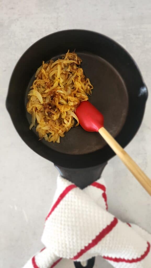 cast iron skillet with caramelized onions