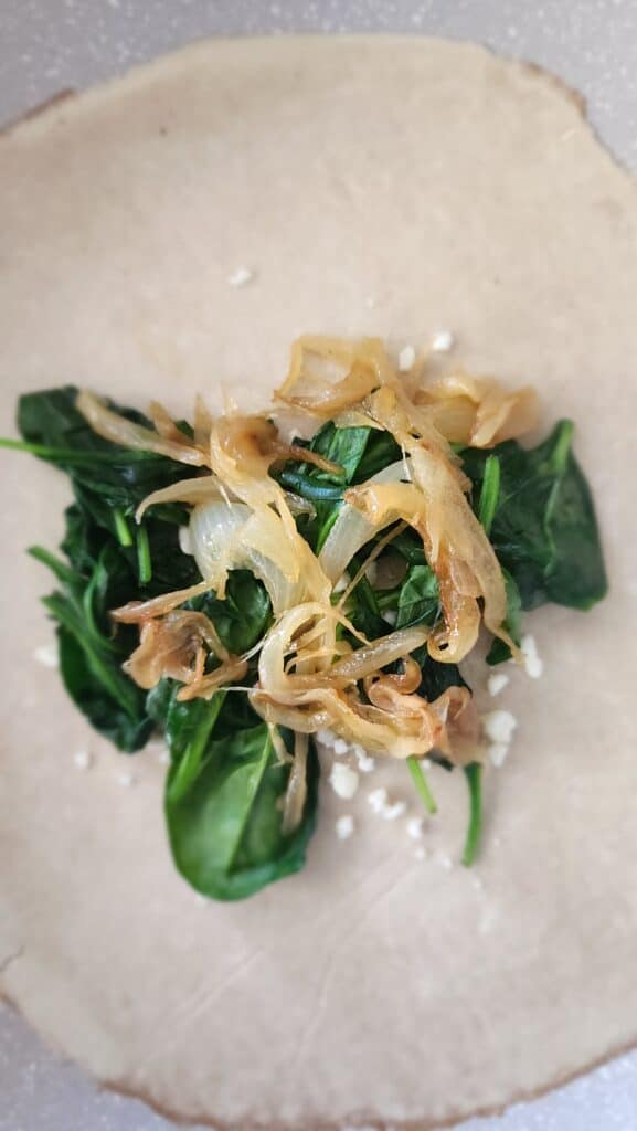 crepe with feta, spinach, and caramelized onions