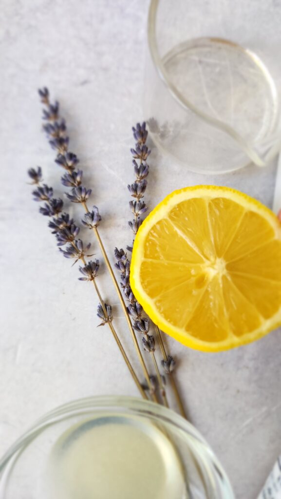 close-up picture of a cut open lemon and dried lavender