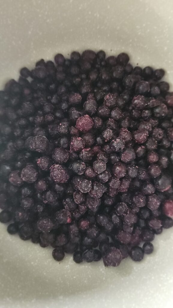 frozen blueberries about to be simmered for blueberry frozen yogurt