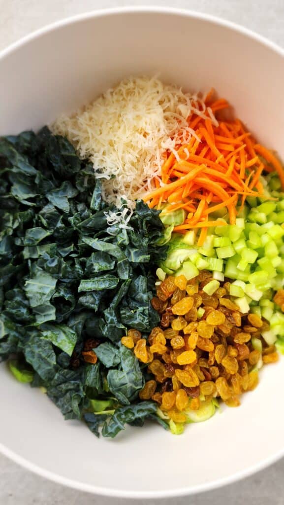 all the ingredients in the kale brussels salad in a bowl