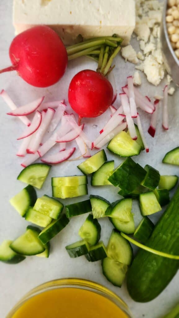 close-up of radish and cucumber for lemon couscous salad