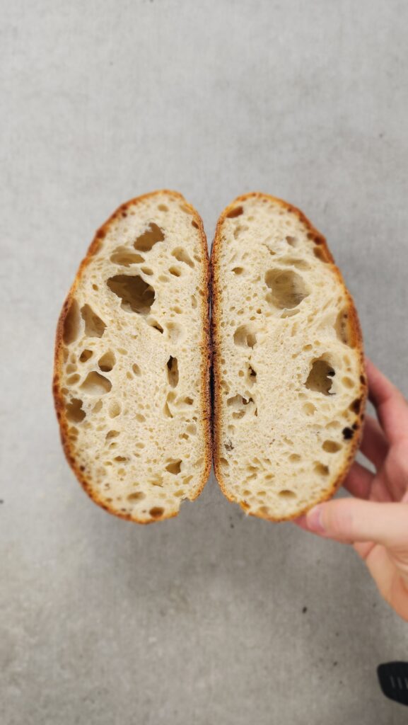 sourdough loaf cut open to see the inside cut