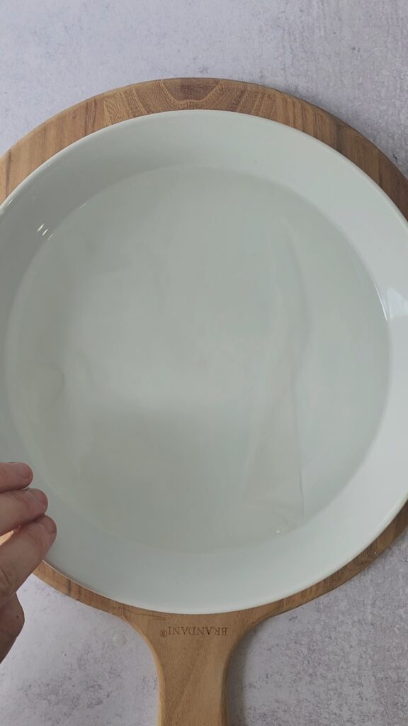 rice wrapper soaking in water for shrimp spring rolls