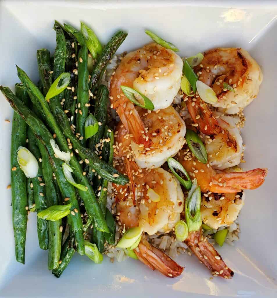 plate of rice, shrimp, and green beans