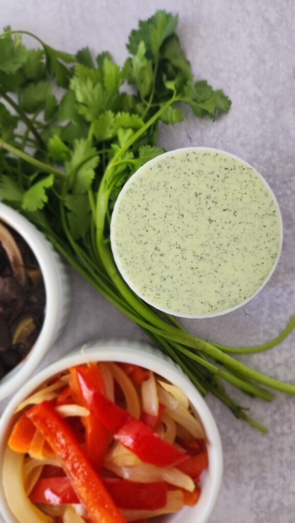 ramekin of cilantro jalapeno sauce for Chipotle Burrito Bowls