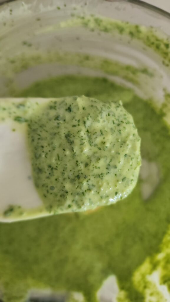 a spatula scoop of the cilantro jalapeno sauce blended up