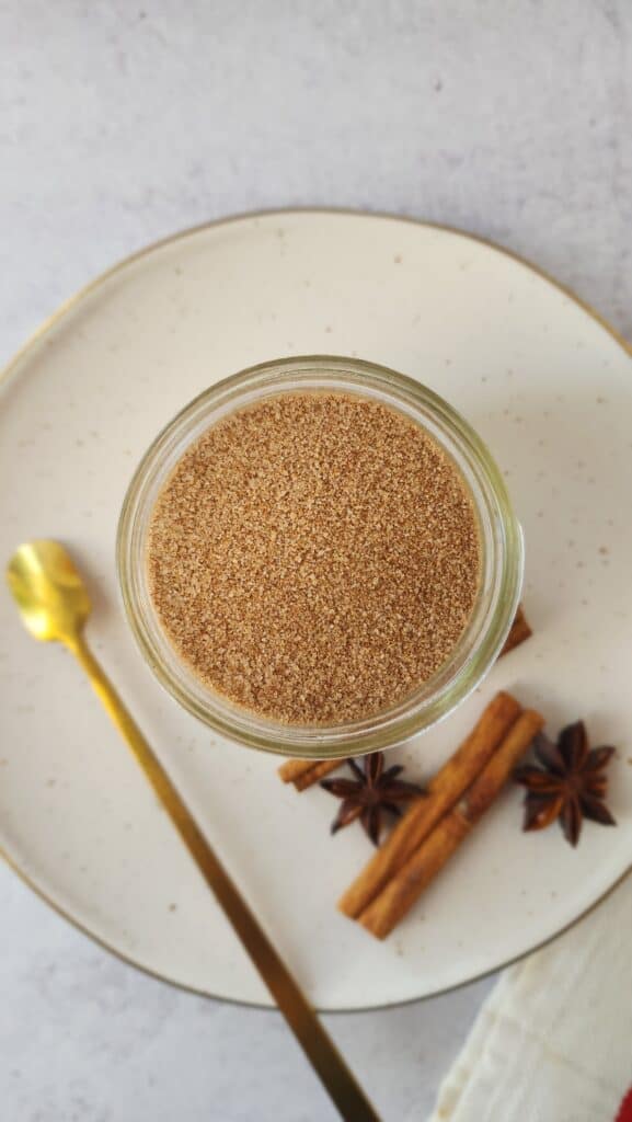 glass jar of cinnamon sugar mix for rimming an apple cider mimosa