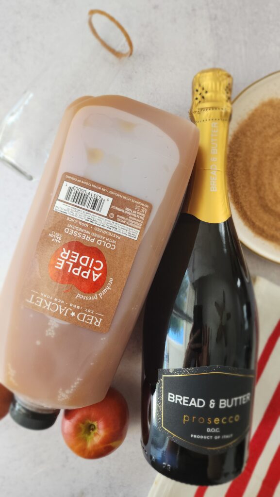 ingredients for an apple cider mimosa: apple cider, champagne