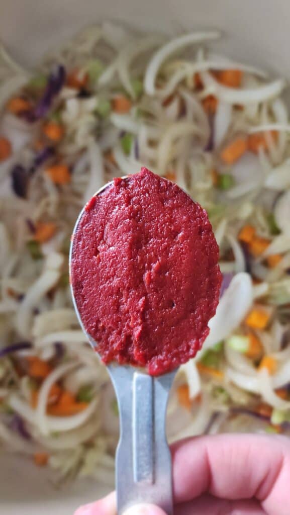 adding tomato paste to sauteed vegetables for Easy Ribollita Soup