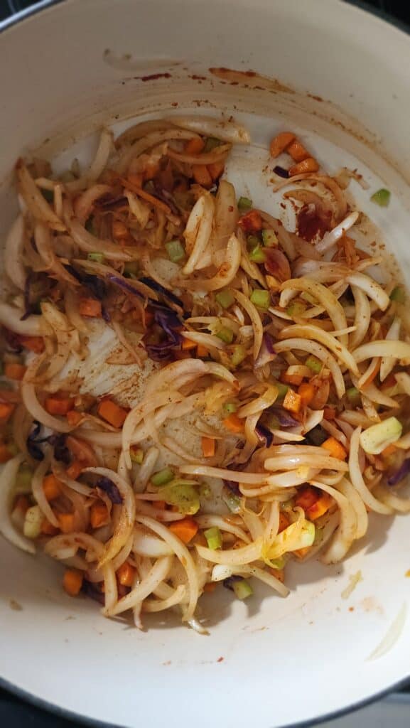 tomato paste dissolved into veggies for Easy Ribollita Soup