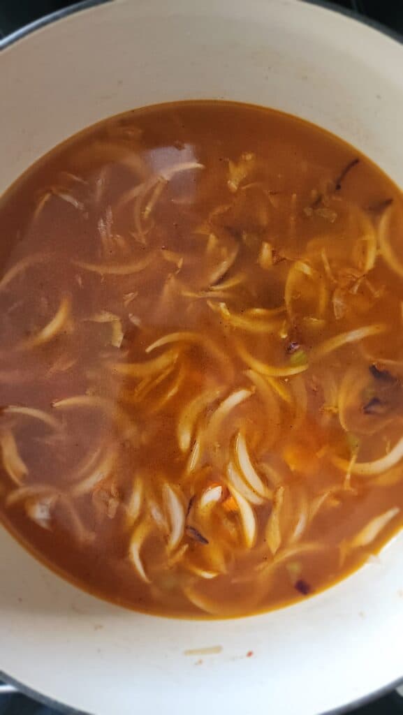 chicken stock adding to simmered vegetables for Easy Ribollita Soup