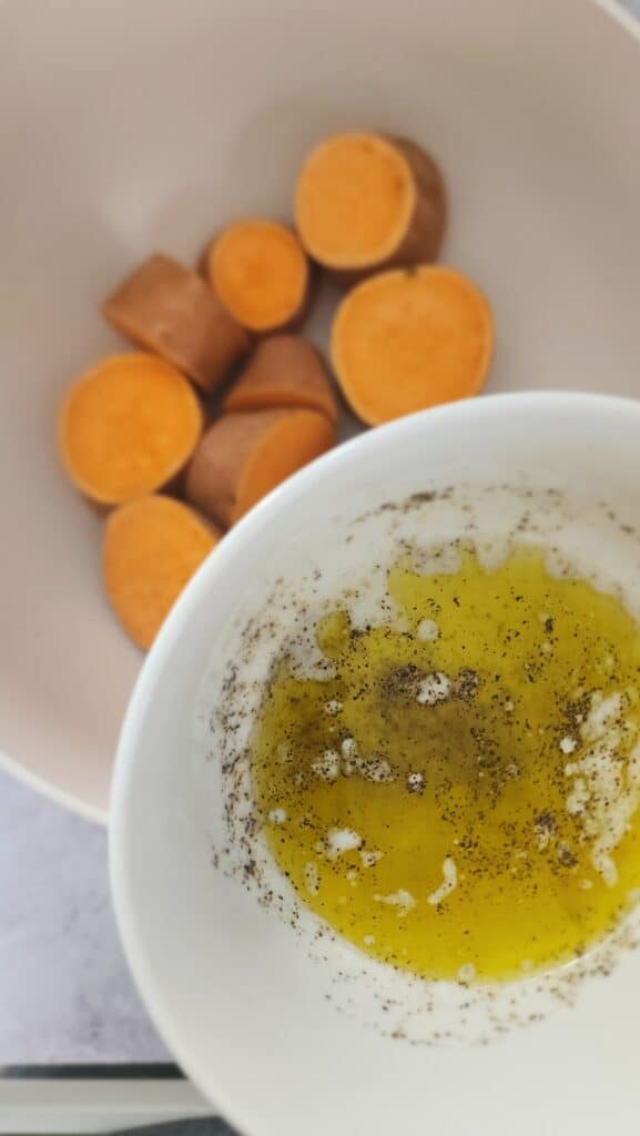 drizzling the melted butter and olive oil over the sweet potatoes for melting sweet potatoes