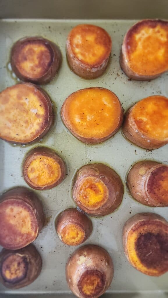 pan with sweet potatoes that have been flipped and are crisp for melting sweet potatoes