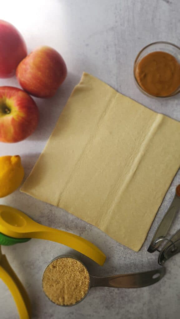 ingredients for puff pastry apple tart: puff pastry, apples, cinnamon, lemon juice, brown sugar