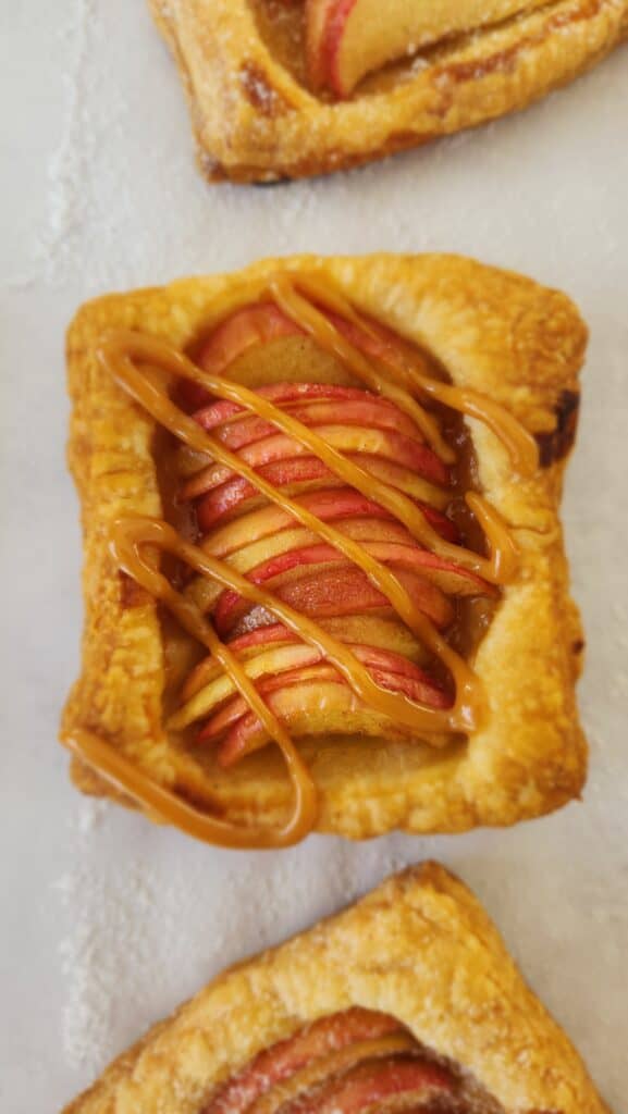 one single puff pastry apple tart drizzled with dulce de leche