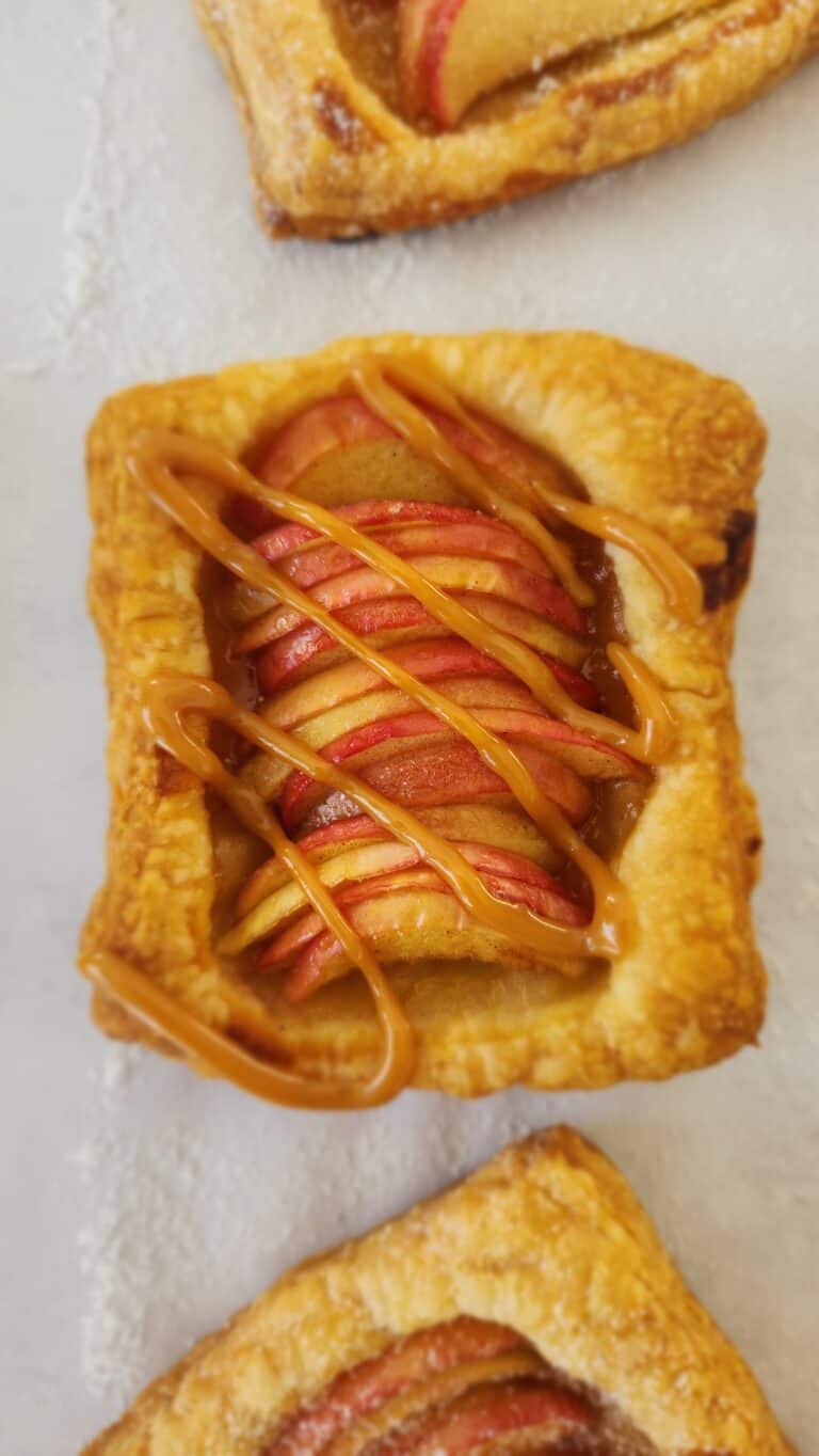 one single puff pastry apple tart drizzled with dulce de leche