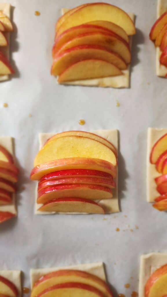 apple slices on the puff pastry ready to bake for puff pastry apple tart