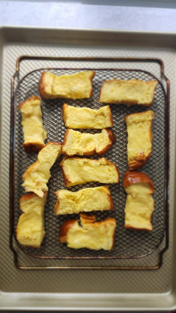 all the Brioche bread laid out on the pan to make Air Fryer French Toast Sticks