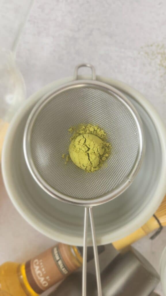 matcha in a sifter ready to be sifted for a matcha martini