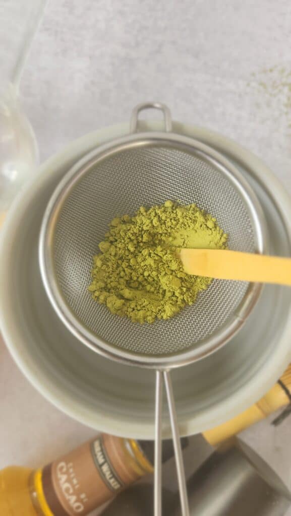 sifting the matcha for a matcha martini