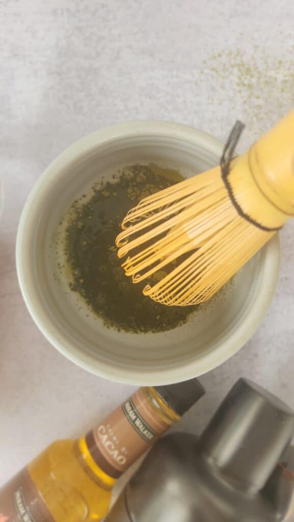 whisking the matcha and warm water