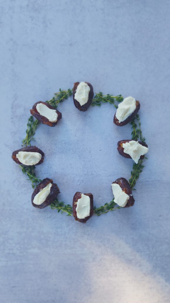 circle wreath of dates stuffed with goat cheese