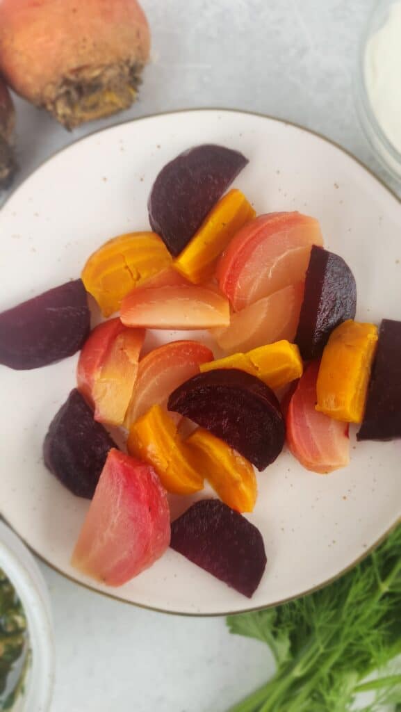 plate of roasted beets (red and orange) for Roasted Beets and Labneh Salad with Walnut Gremolata