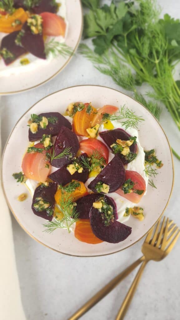 plated final picture of roasted beets and labneh with walnut gremolata on a plate