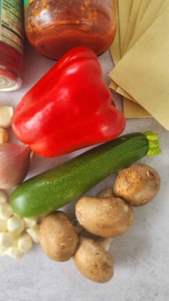 veggies: red bell pepper, zucchini, and mushrooms for skillet lasagna (not cut)