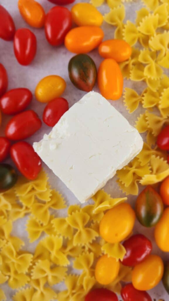 ingredients for Baked Feta Pasta focused on the block of feta
