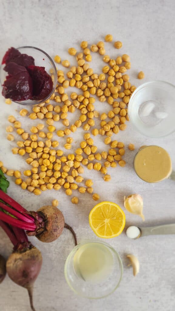 ingredients for roasted beet hummus: roasted beets, tahini, chickpeas, garlic, lemon juice, water, salt