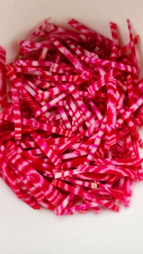 chiogga beets cut into matchsticks for Shredded Beet and Apple salad