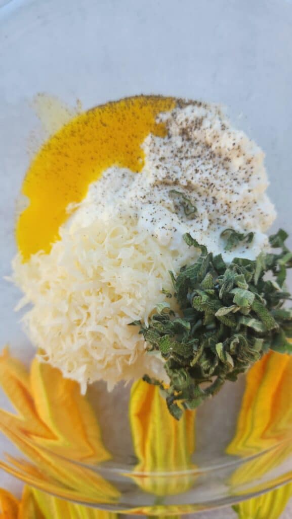 all the ingredients about to mixed together for Fried Stuffed Squash Blossoms
