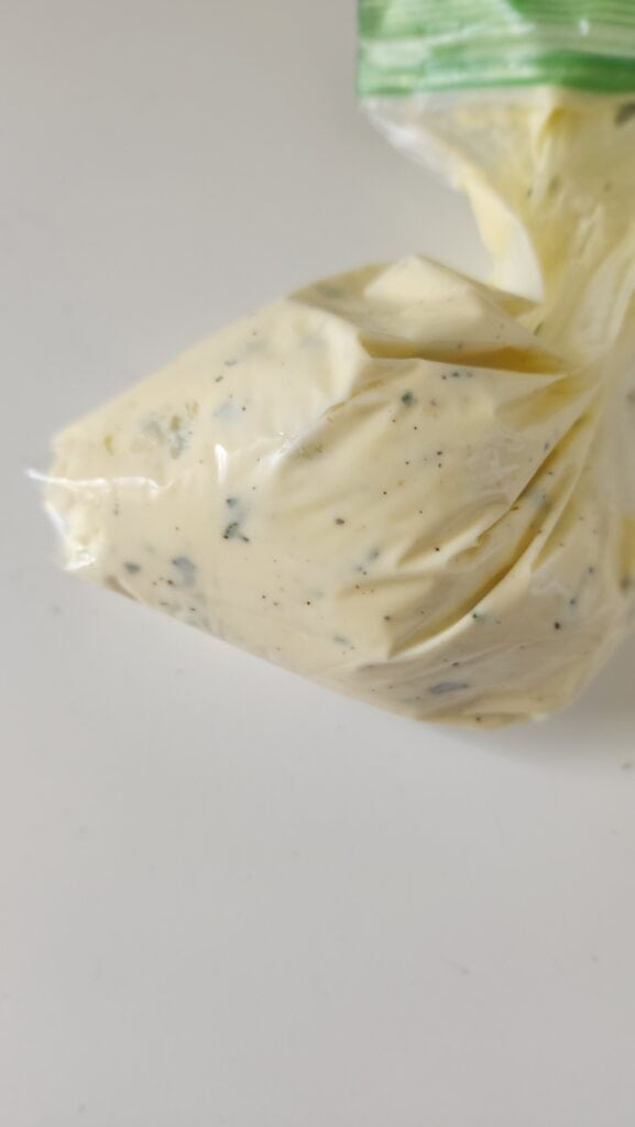 ziploc bag with the ricotta filling inside ready to stuff the squash blossoms