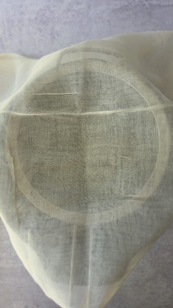 cheesecloth over a colander to strain the homemade ricotta
