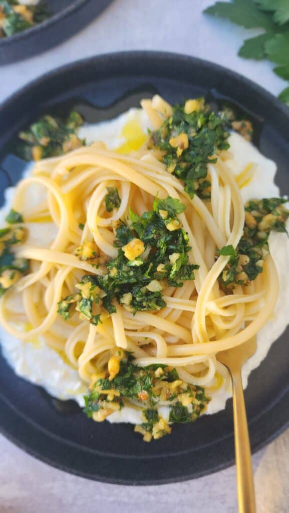 plate of lemon ricotta pasta with walnut gremolata