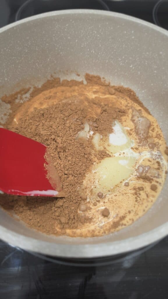 mixing the ingredients together to make hot fudge sauce; pre-mix