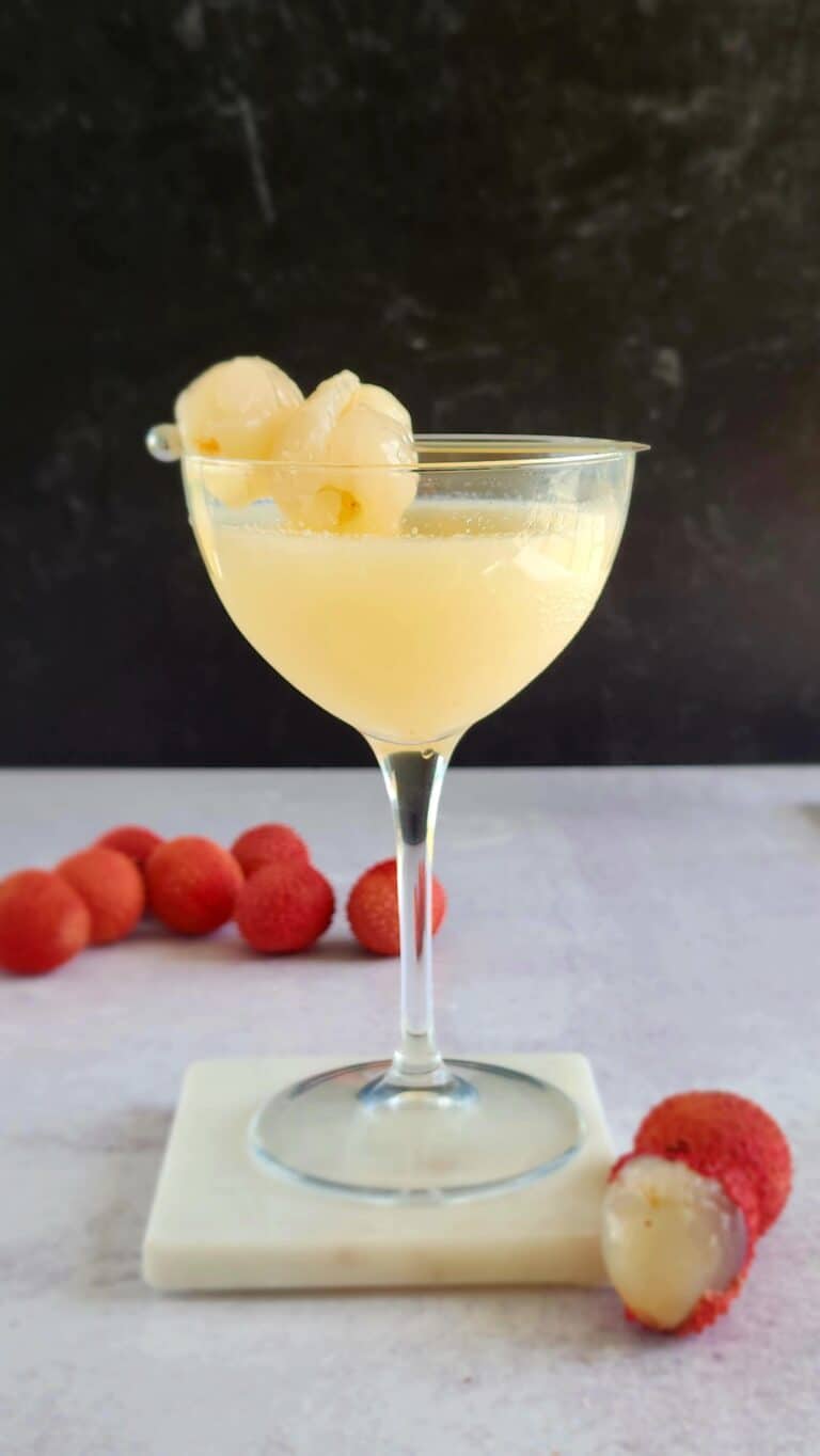 lychee martini with a couple lychees for garnish