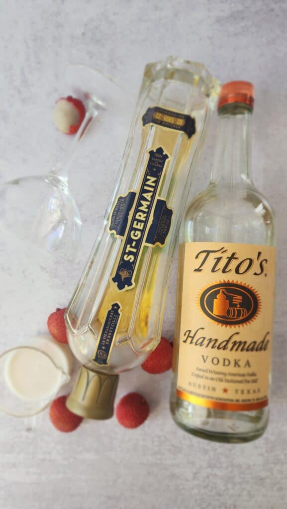 ingredients for a lychee martini: lychee puree, elderflower liquor, vodka, lychees
