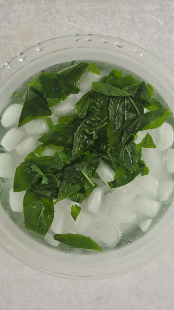 placing the basil on cold water - blanching the basil