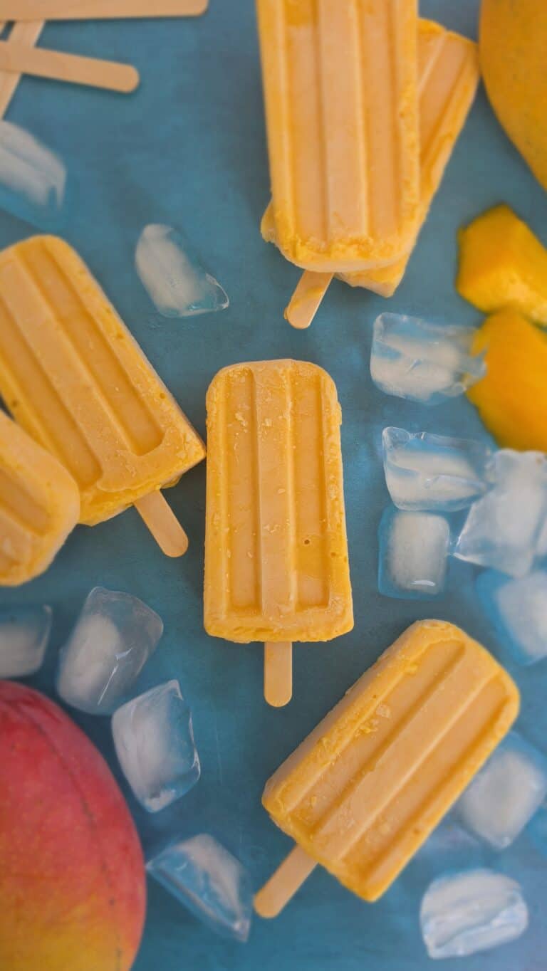 creamy mango popsicles
