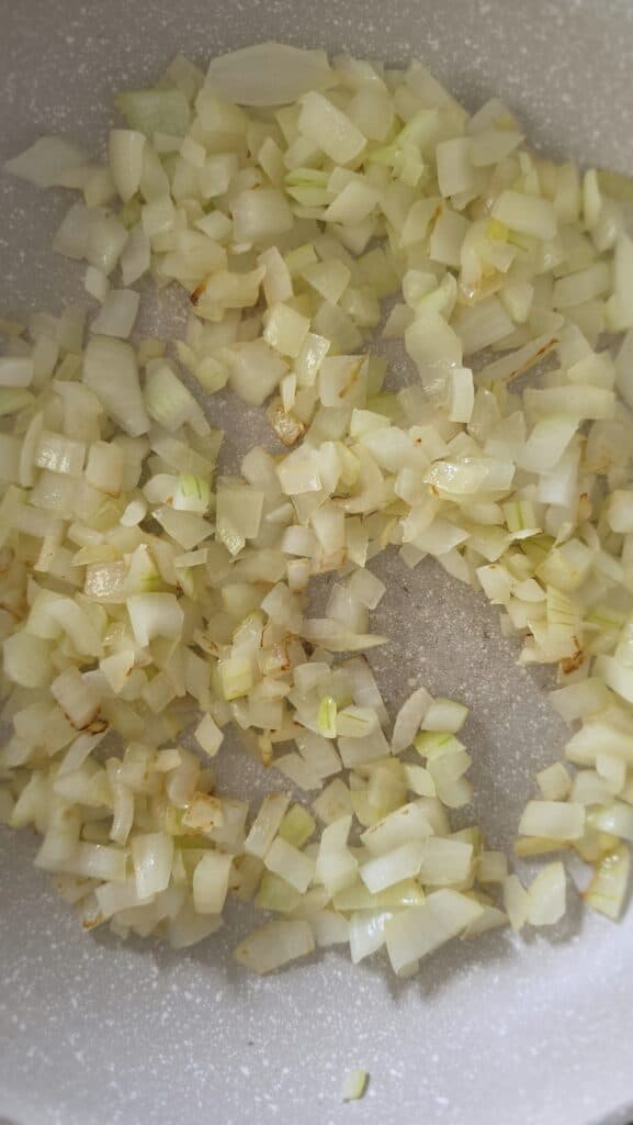 cooked onion in a sauté pan