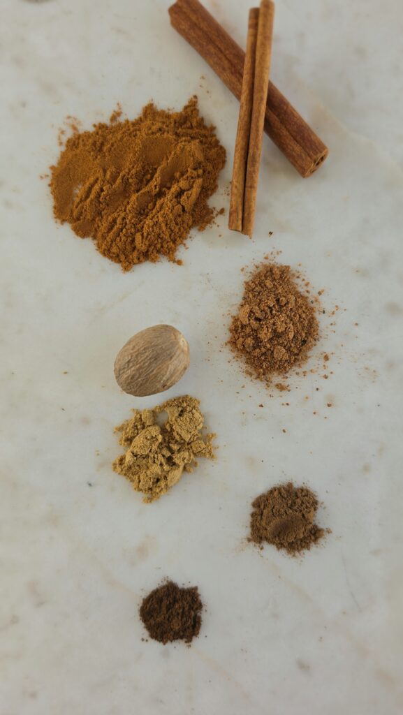 ingredients for homemade pumpkin pie spice: cinnamon, ground ginger, ground nutmeg, ground allspice, ground cloves
