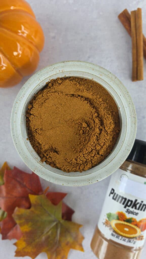 all the spices for homemade pumpkin pie spice mixed in a bowl