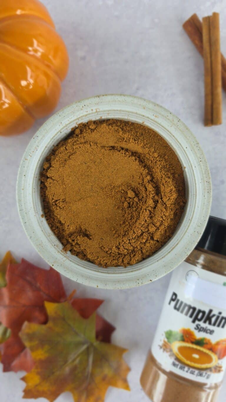 all the spices for homemade pumpkin pie spice mixed in a bowl