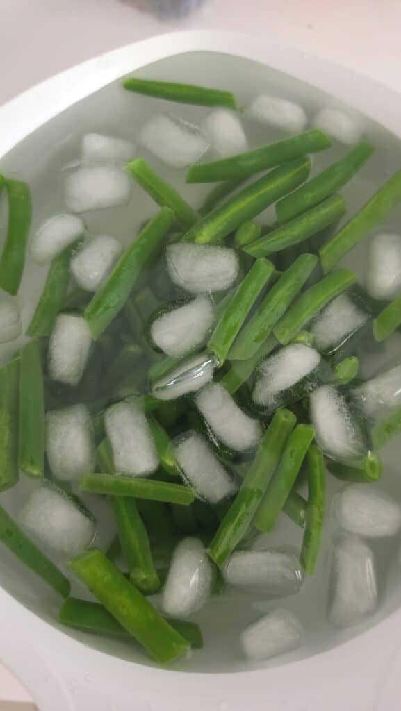 cold water bath for the green beans for easy three-bean salad